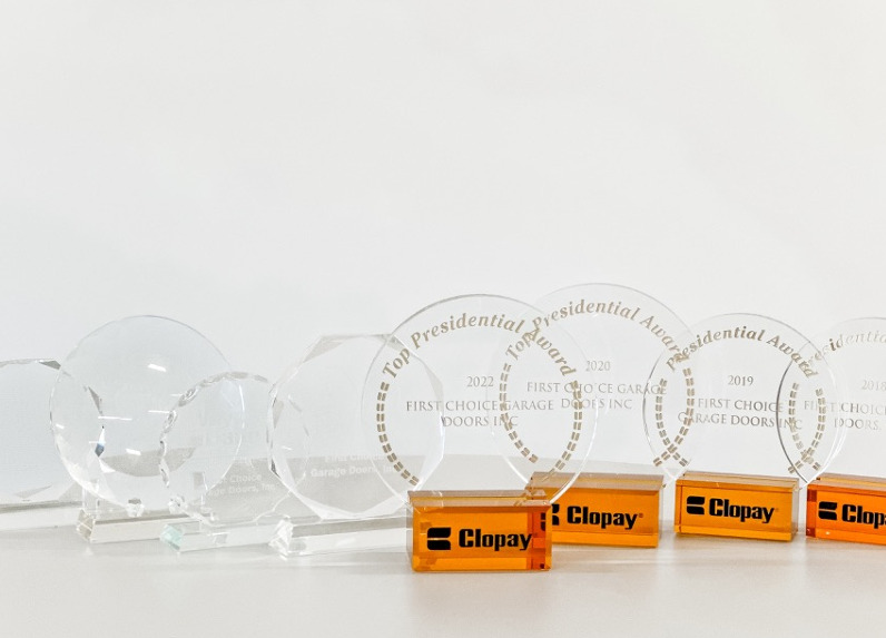 Clopay Top Presidential Award trophies awarded to First Choice Garage Doors