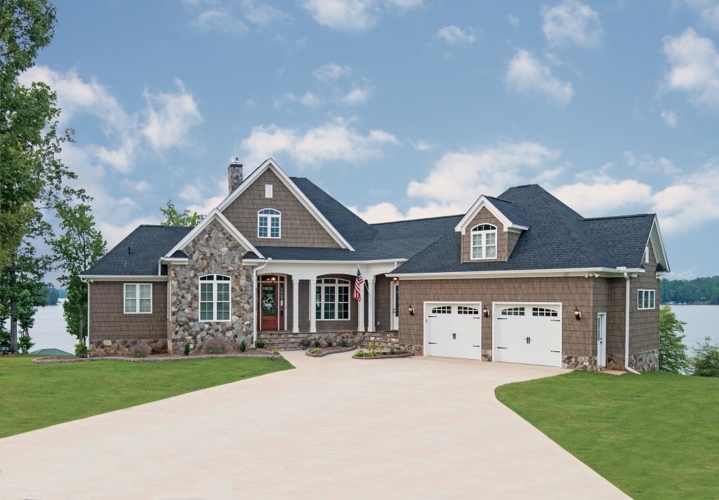 Residential garage doors on a lakeside home